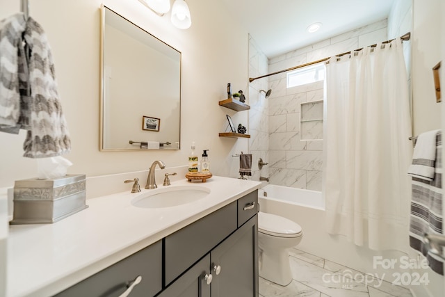 full bathroom with shower / tub combo with curtain, vanity, and toilet