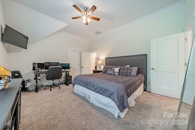 bedroom featuring ornamental molding, ceiling fan, and light colored carpet