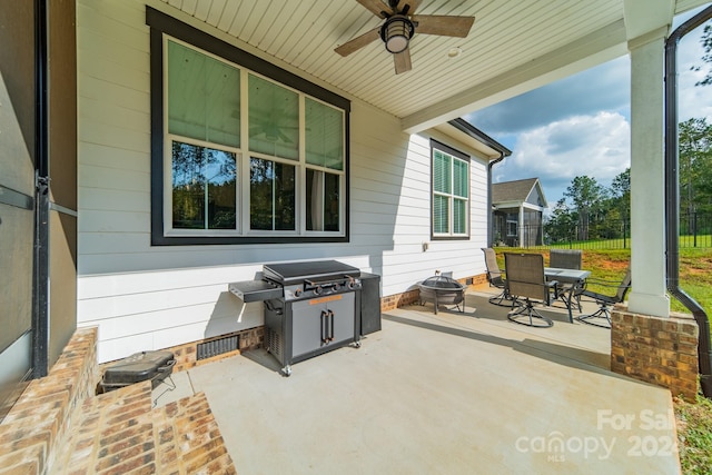 view of patio / terrace with a grill and ceiling fan