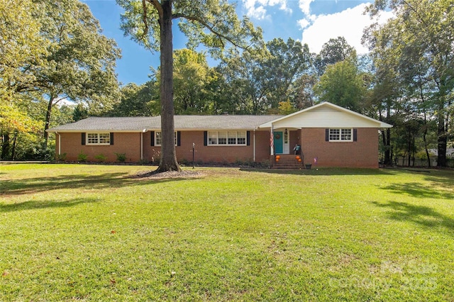 ranch-style house featuring a front lawn