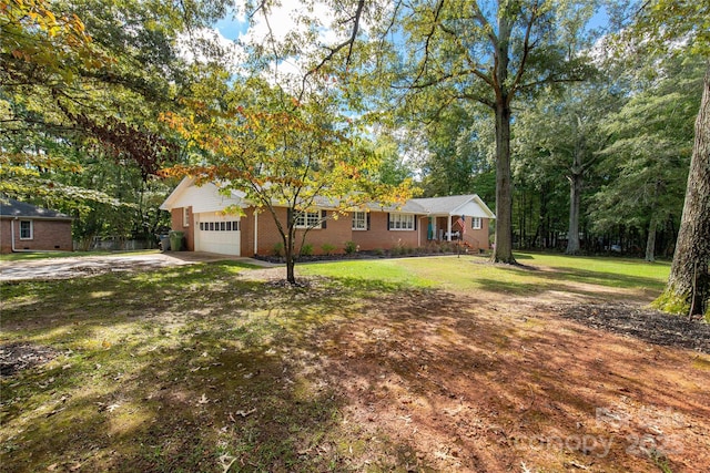 ranch-style home with a garage and a front lawn