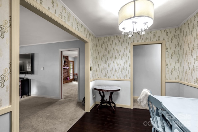 dining space with ornamental molding, dark hardwood / wood-style flooring, and a chandelier