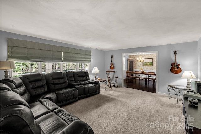 living room with an inviting chandelier and carpet floors