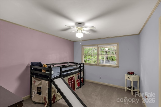 bedroom featuring crown molding, carpet, and ceiling fan