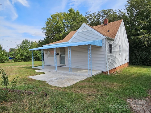 145 33rd St SW, Hickory, NC 28602 - exterior space with crawl space, a patio, a front lawn, a chimney, and a shingled roof