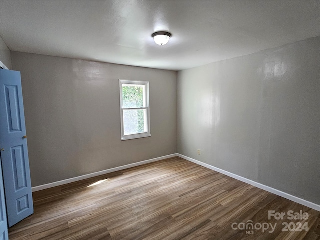 145 33rd St SW, Hickory, NC 28602 - empty room featuring wood finished floors and baseboards