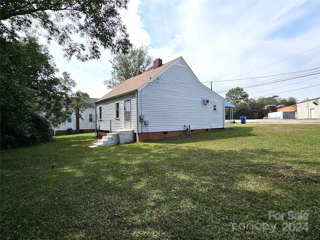 145 33rd St SW, Hickory, NC 28602 - back of property featuring crawl space, a yard, a chimney, and a shingled roof