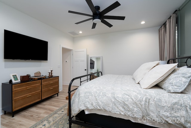 bedroom featuring light hardwood / wood-style floors and ceiling fan