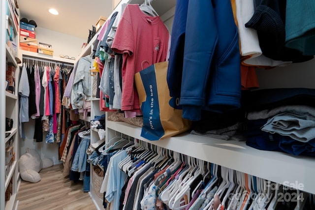 spacious closet featuring light hardwood / wood-style floors