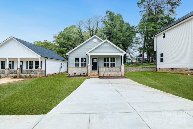 view of front of home featuring a front lawn and a porch