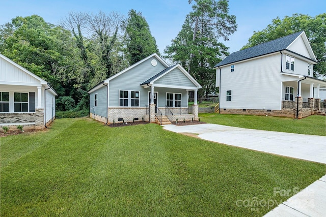 view of front of home with a porch and a front yard