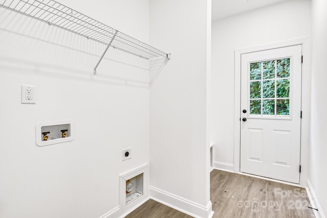 laundry room with washer hookup, electric dryer hookup, and hardwood / wood-style floors