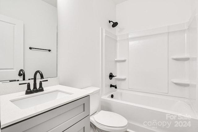 full bathroom featuring bathing tub / shower combination, vanity, and toilet