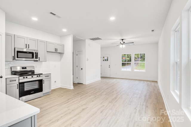 602 Meadow St, Spencer, NC 28159 - kitchen featuring appliances with stainless steel finishes, light countertops, a ceiling fan, gray cabinets, and recessed lighting