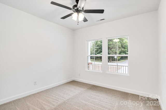 602 Meadow St, Spencer, NC 28159 - empty room with light colored carpet and a ceiling fan