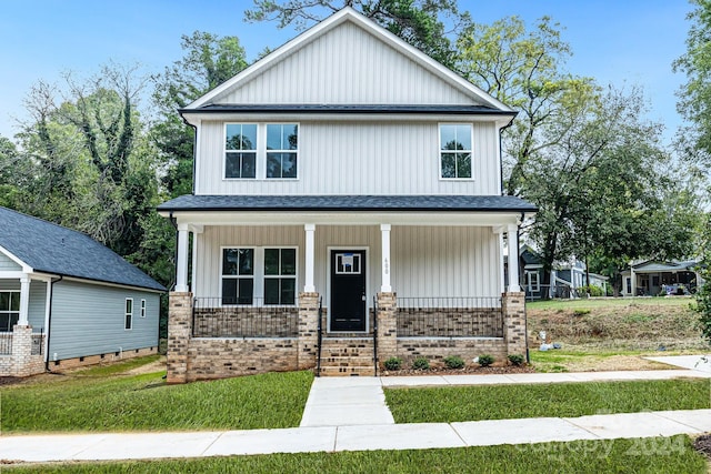 craftsman-style home featuring a front yard and a porch