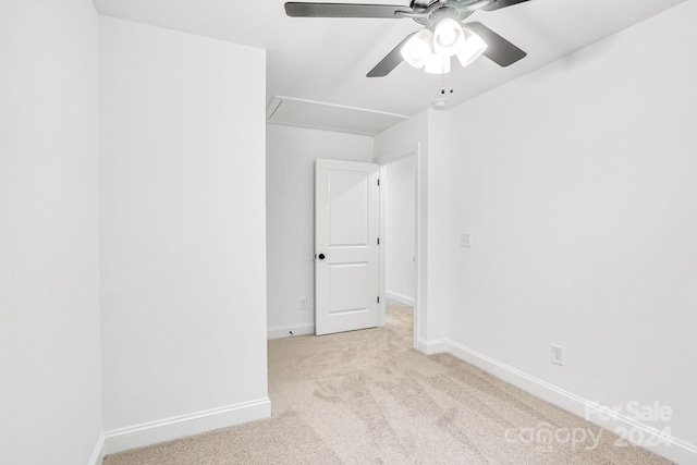 carpeted empty room featuring ceiling fan