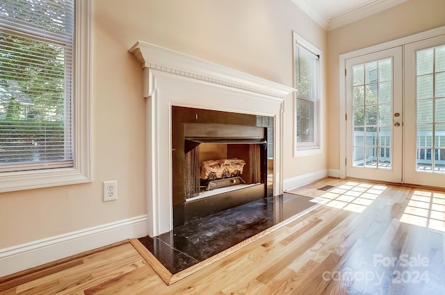 doorway featuring french doors, crown molding, and hardwood / wood-style flooring