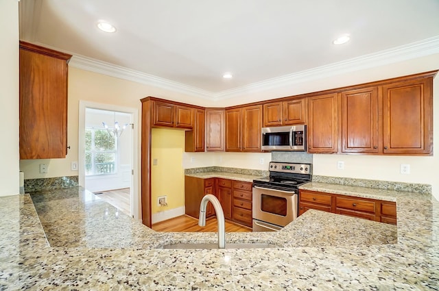 kitchen featuring light hardwood / wood-style flooring, sink, light stone counters, stainless steel appliances, and ornamental molding