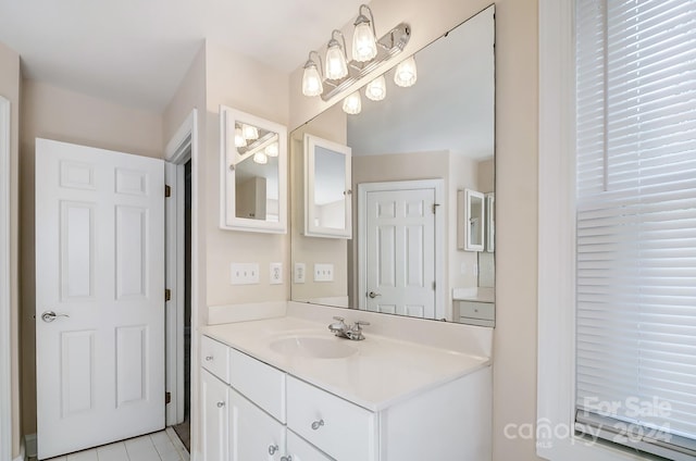 bathroom featuring tile patterned flooring and vanity