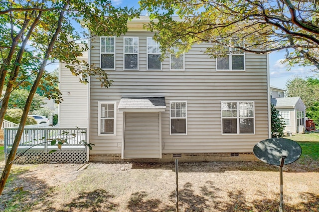 rear view of house with a wooden deck