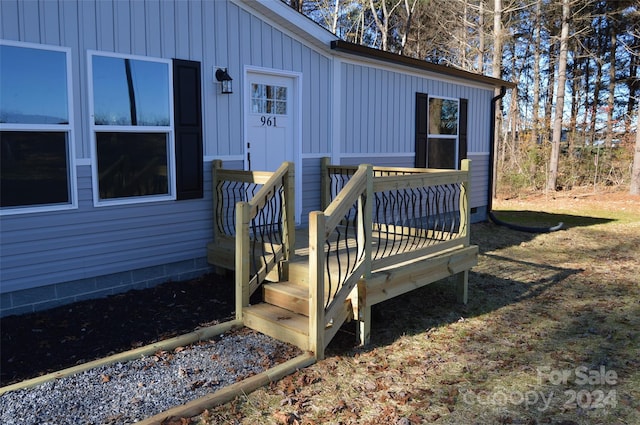 entrance to property with a deck