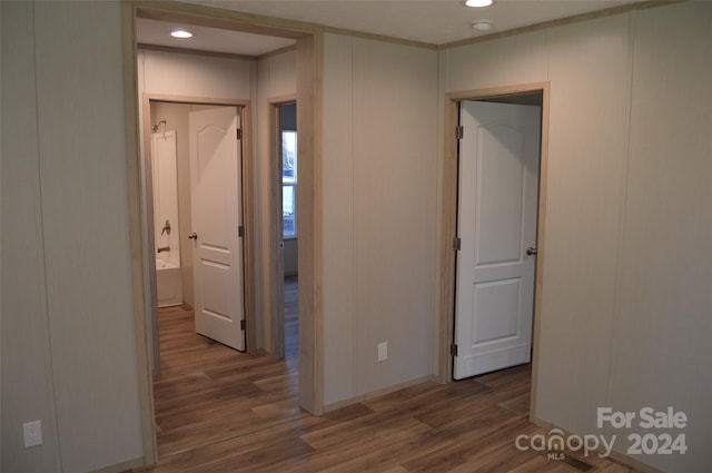 corridor with dark hardwood / wood-style flooring