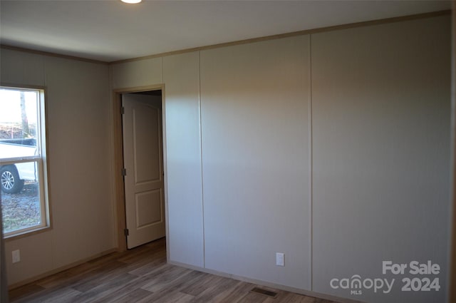 unfurnished bedroom with light wood-type flooring