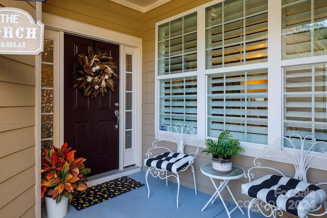 entrance to property featuring a porch