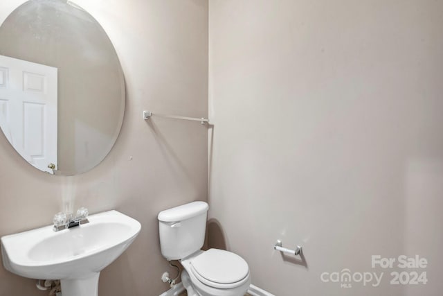 bathroom with sink and toilet