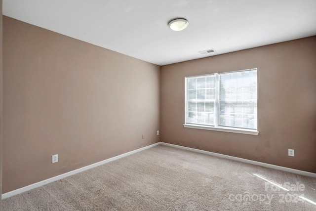 empty room featuring carpet flooring