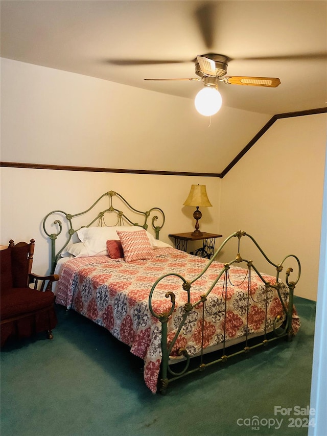 bedroom with ceiling fan, lofted ceiling, and carpet floors