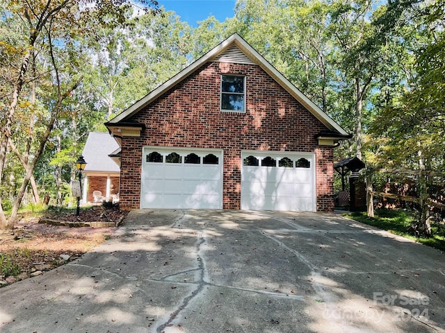 view of side of home featuring a garage