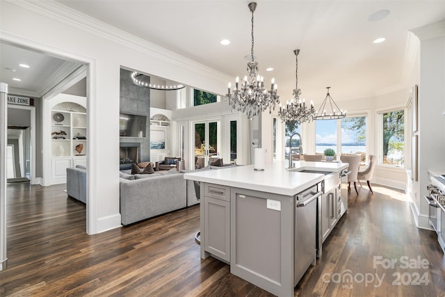 kitchen featuring an island with sink, dishwasher, dark hardwood / wood-style flooring, and ornamental molding