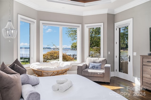 bedroom with multiple windows, crown molding, a water view, and dark hardwood / wood-style floors