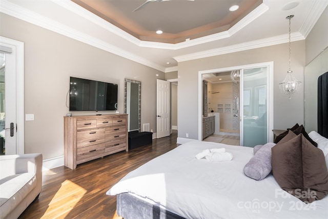 bedroom featuring ensuite bathroom, dark wood-type flooring, a chandelier, and crown molding