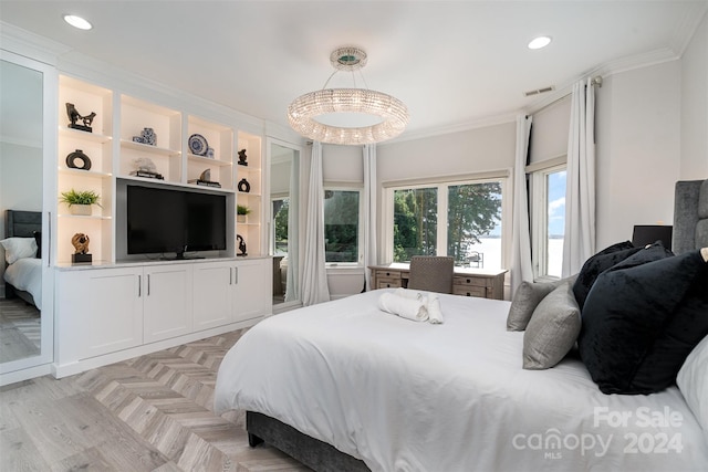 bedroom featuring a chandelier, crown molding, and light parquet floors