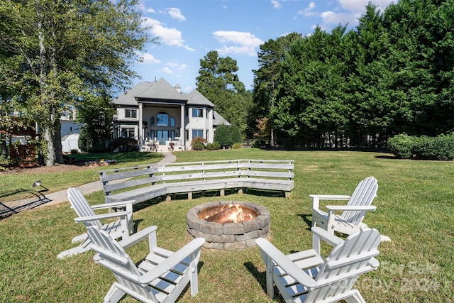 view of yard with an outdoor fire pit