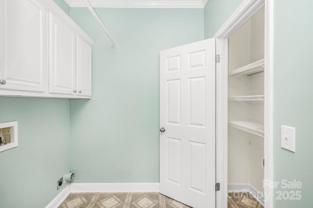 washroom featuring cabinets, ornamental molding, hookup for a washing machine, and electric dryer hookup