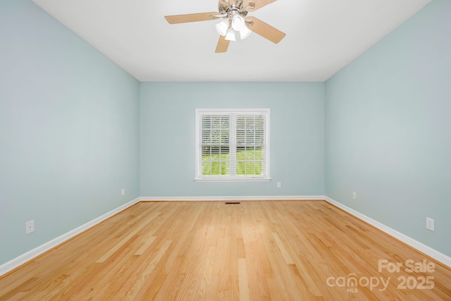 unfurnished room with ceiling fan and hardwood / wood-style floors