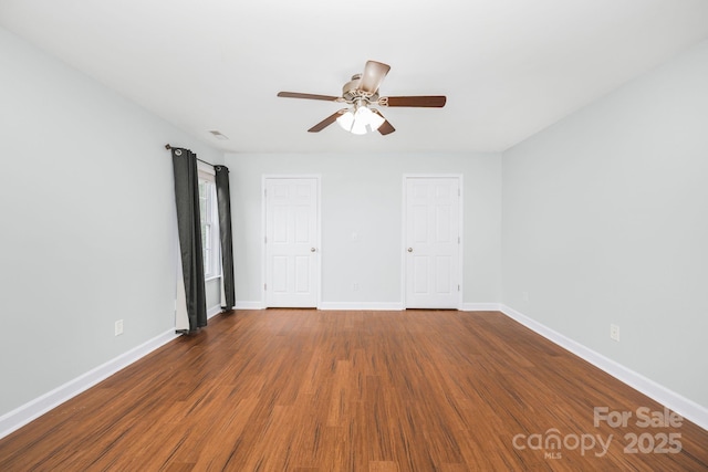 unfurnished room featuring hardwood / wood-style floors and ceiling fan