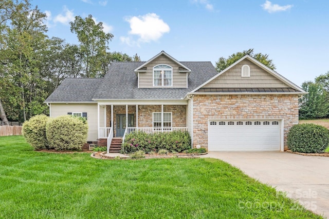 view of front of property with a garage, a front lawn, and covered porch