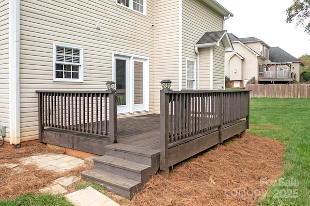 wooden terrace with a yard