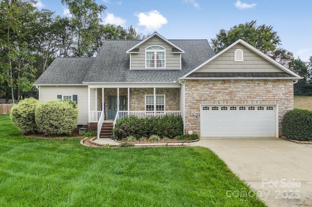 view of front of house featuring a porch, a garage, and a front yard