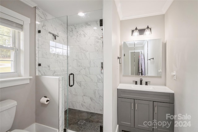 bathroom with vanity, toilet, an enclosed shower, and crown molding