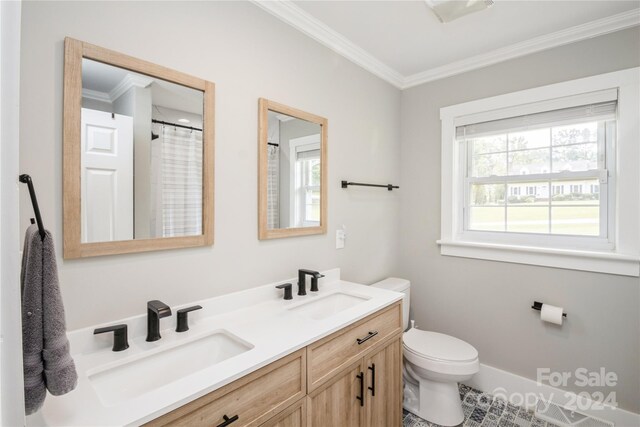 bathroom featuring crown molding, tile patterned flooring, vanity, and toilet