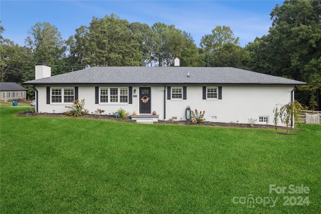 ranch-style house with a front lawn