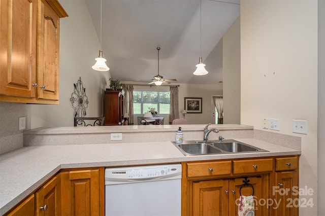 kitchen with vaulted ceiling, white dishwasher, decorative light fixtures, and sink