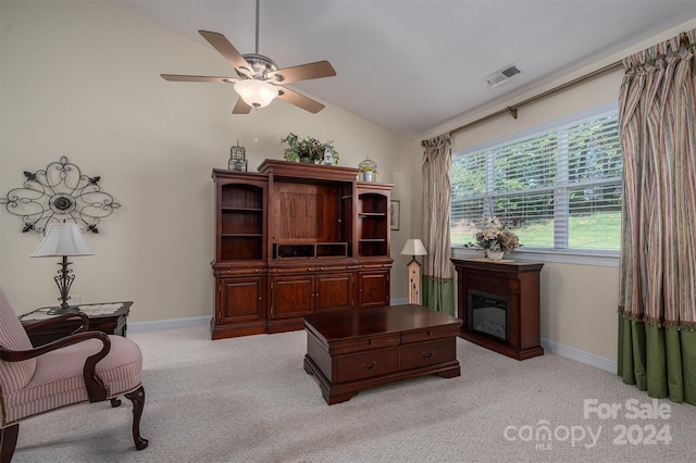 office space featuring ceiling fan, light colored carpet, and lofted ceiling