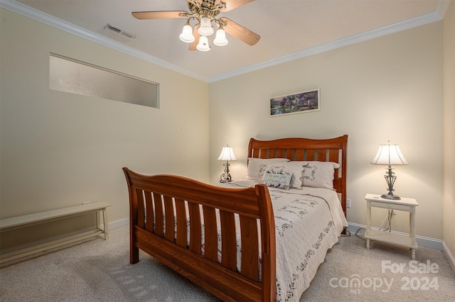 carpeted bedroom with crown molding and ceiling fan